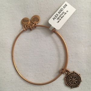 Alex and Ani Take The Wheel gold charm bracelet.